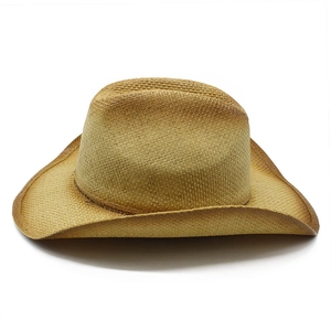 Close-up of woven straw cowboy hat showing gradient brown brim and detailed texture