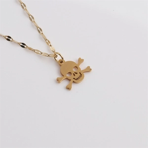 Golden stainless steel skull and crossbones pendant necklace on a clean white background