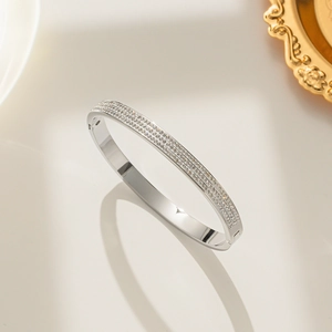 Elegant silver stainless steel bracelet with three rows of sparkling crystal zircons