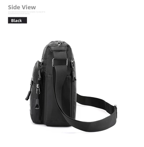 Side view of large capacity black nylon messenger bag with multiple zipper compartments