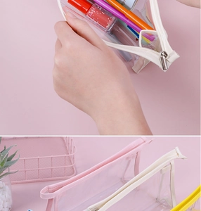 Detail of transparent PVC pencil case showing the zipper closure and large capacity