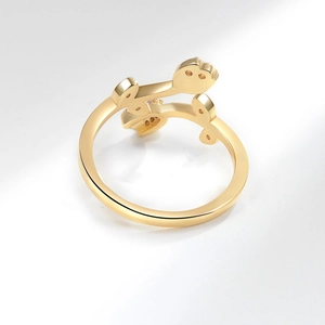 Elegant gold tulip flower open ring with polished metal texture on white background