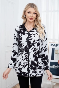 Detail of floral hooded jacket with metal zipper and adjustable waist drawstring