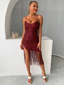 Detail of a deep red sequined dress with fringe hem and a sexy high side slit for women