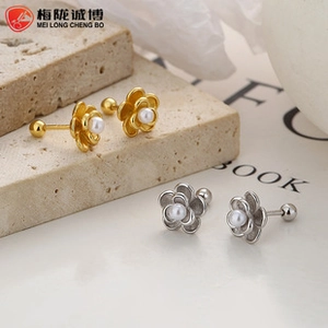 Detailed view of 925 silver rose earrings with pearl center and screw back closure
