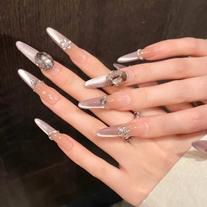 Long almond press-on nails with purple cat-eye gradient and baroque crystal charms