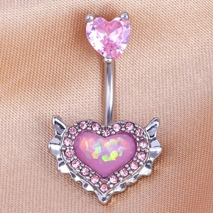 Pink heart belly button ring with angel wings and zircon on champagne silk background