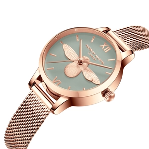 Montre élégante en or rose avec motif abeille 3D sur un cadran vert minimaliste
