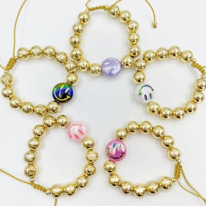 Five-piece set of 18k gold-plated beaded bracelets with colorful smiley face charms