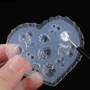 Heart-shaped silicone nail mold with strawberry and cherry patterns for DIY nail art
