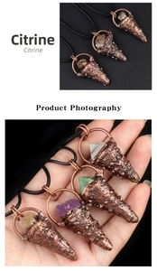 Macro view of natural citrine stone pendant with vintage bronze finish details