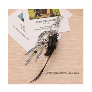 Handmade dreamcatcher keychain with black feathers, opal stone, and yin yang charm pendant