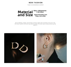 Detailed view of D-letter zircon hoop earrings with gold finish and rhinestone accents