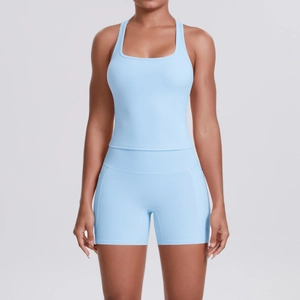 Women's light blue racerback sports top and high waist compression yoga shorts set