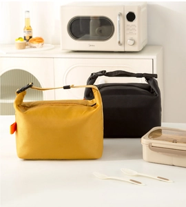 Detail of insulated lunch bags with adjustable buckle handles and ripstop nylon texture