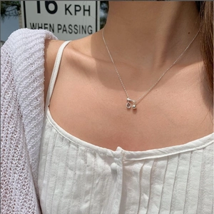 925 silver necklace with teardrop zircon and round ball pendant on female model