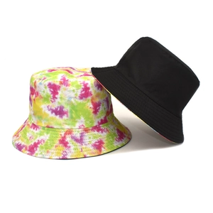 Double-sided tie-dye bucket hat with colorful pattern and solid black canvas design