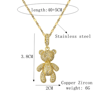 Detail of gold teddy bear necklace with copper zircon pendant and stainless steel chain