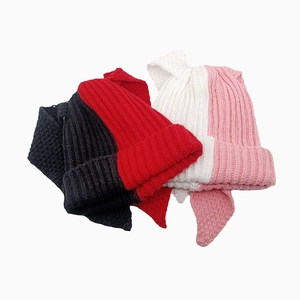 Detail showing thick knit texture and ear flaps of bicolor cat ear winter beanies