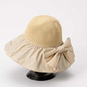 Beige wide brim sun hat for women with oversized bow detail for UV protection
