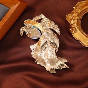 Vintage French enamel goldfish brooch back view with gold pin on silk backdrop