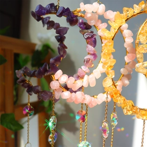 Three crescent moon suncatchers with natural amethyst stones and colorful crystal prisms