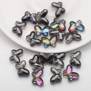 Detailed macro shot of gradient butterfly glass beads for DIY jewelry and necklaces