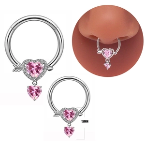 Detail of 12mm silver heart nose ring with pink gemstone and hanging pendant on model