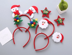 Close-up of festive Christmas headbands with felt Santa Claus and snowman motifs