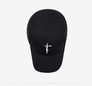 Top view of black baseball cap featuring white cross and Faith embroidery on crown