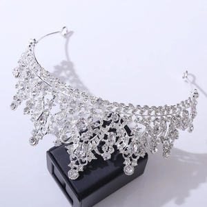 Detail of luxury bridal tiara with sparkling rhinestones on silver base over a black box