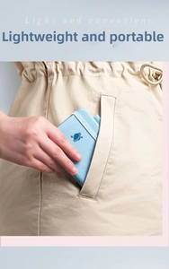 Macro detail of sky blue pocket notebook with elastic strap showing portable mini design