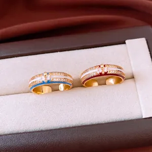 18k gold plated adjustable ring with zircon fleur-de-lis and vintage enamel detail