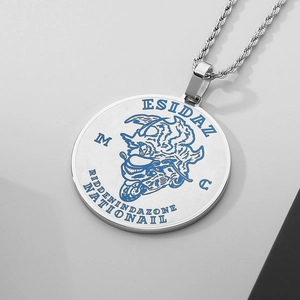 Detailed view of punk round pendant with blue enamel engravings on twisted chain
