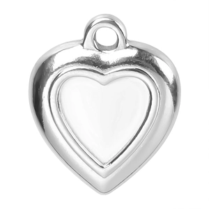 Close-up of heart-shaped stainless steel pendant with silver finish and polished surface