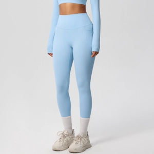 Light blue long sleeve cropped top and high waist yoga leggings with side pockets