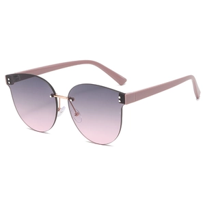 Frameless oversized cat-eye sunglasses with purple to pink gradient lenses and metal dots