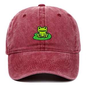 Detailed embroidery of a frog on a lotus leaf on a vintage burgundy cotton baseball cap