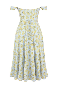 Detail showing the light blue fabric with yellow floral print and off-shoulder neckline