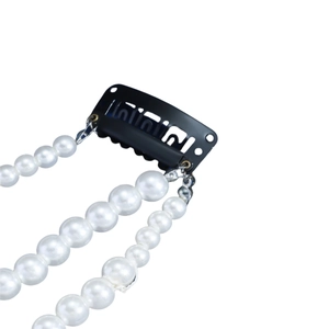 Elegant Korean style hair clip with three rows of hanging white pearls on a black BB clip