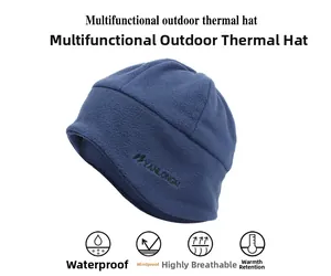 Close-up of deep blue thermal fleece beanie showing windproof fabric and embroidery