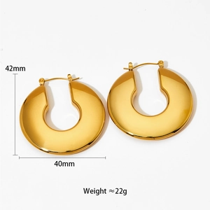 Detail view of large gold hollow earrings showing 42mm height and 40mm width dimensions