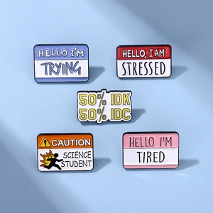 Detail of 5-piece enamel pin set showing humorous quotes and name tag designs