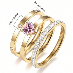 Three-piece gold stainless steel ring set with pink heart-shaped zircon and pave stones