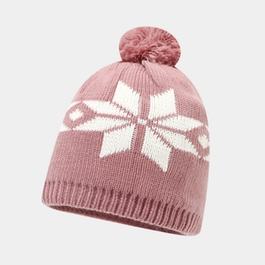 Detail of light pink knitted beanie with white snowflake pattern and fluffy pompom