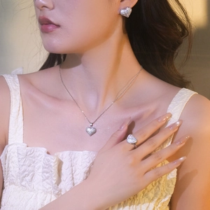 Elegant heart jewelry set with micro-paved zircon crystals including necklace, earrings, and ring
