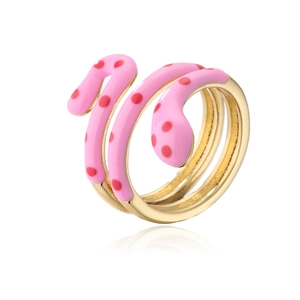 Detailed macro view of gold-plated snake ring with pink enamel and red polka dot pattern