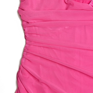 Macro shot of pink mesh fabric with side ruching detail on a bodycon evening dress