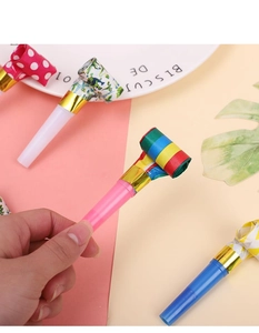 Close-up of colorful party blowouts with golden trim and assorted patterns for kids