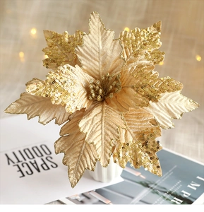 Macro shot of gold artificial Christmas flower with sequins and glitter details